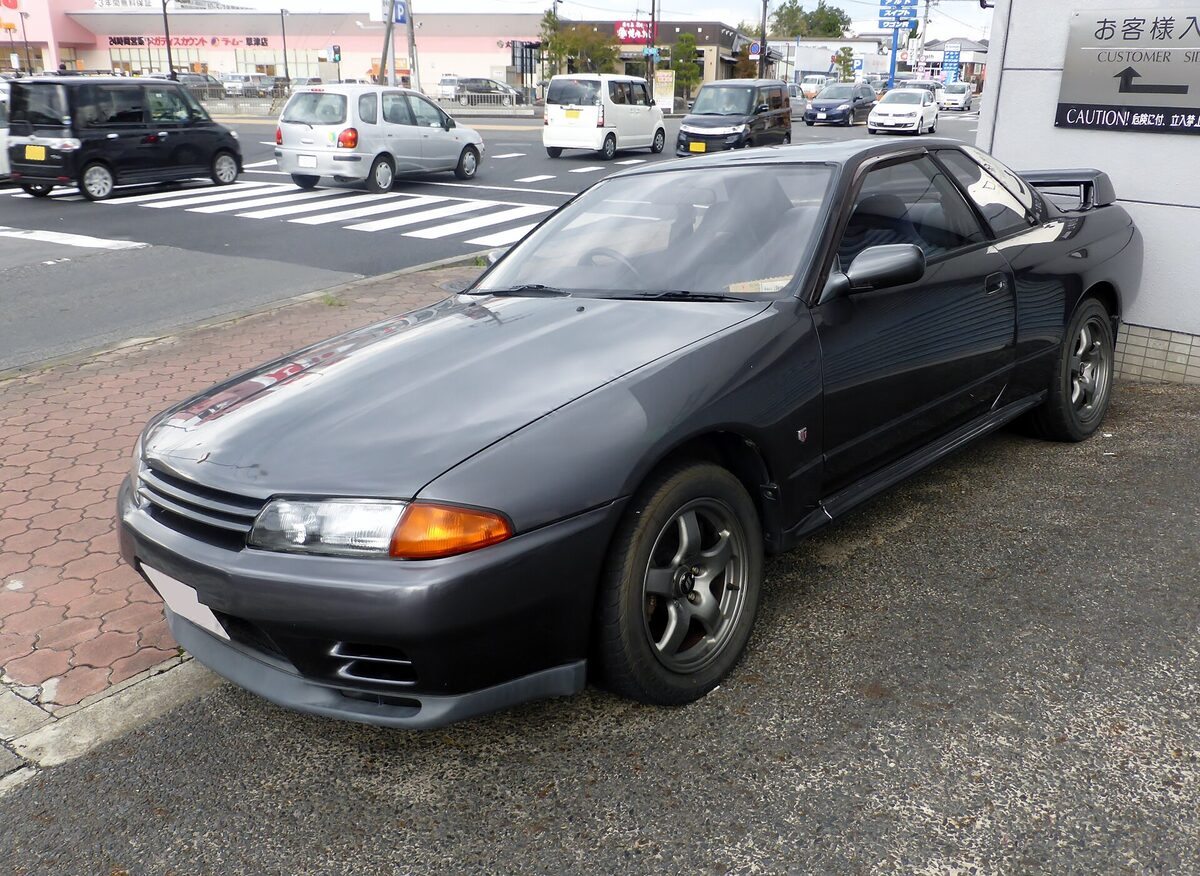 Gun grey Nissan Skyline R32 GT-R parked on the street