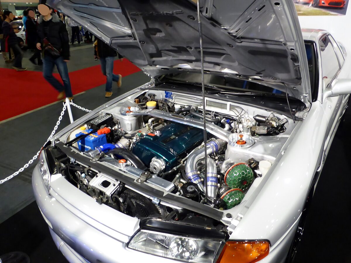 Engine bay of a Nissan Skyline R32 GT-R showing the RB26DETT